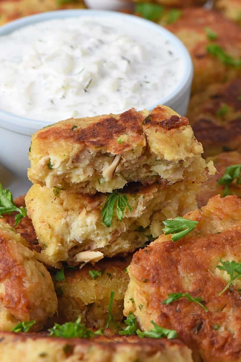 salmon patties cut in half served with salmon patties sauce