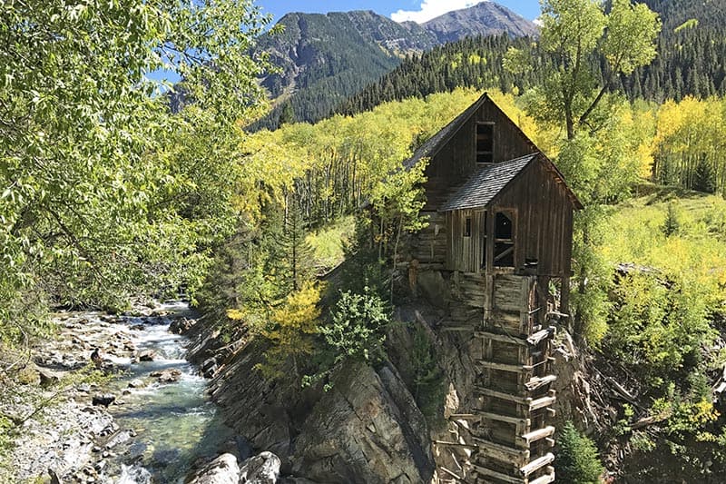 gorgeous Crystal Mill surrounded by yellow aspens in Colorado