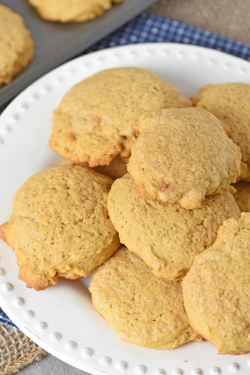 plate full of yummy pumpkin sugar cookies made from scratch