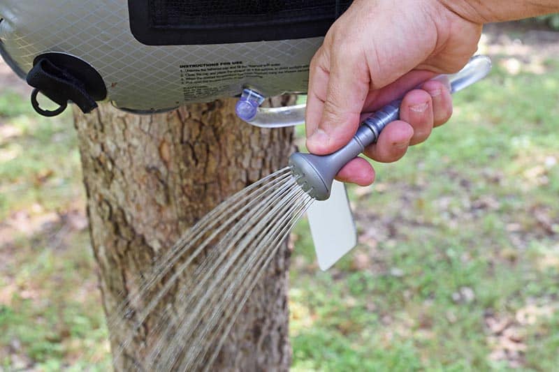 turn the shower head on the Advanced Elements Summer Shower on
