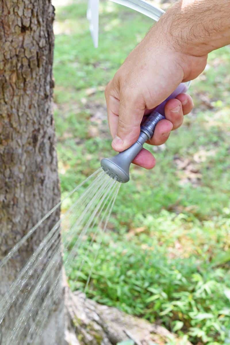 hold the shower head in your hands or hang it up on the Advanced Elements Solar Shower