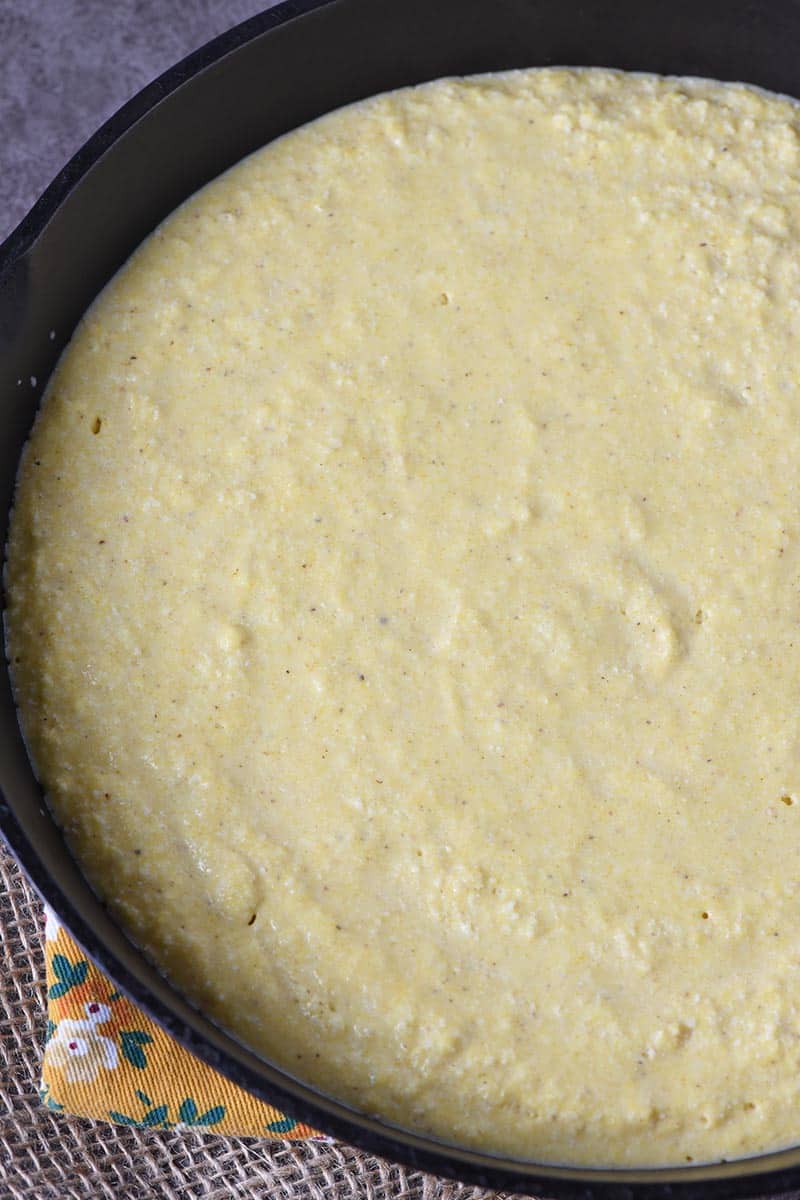 buttermilk cornbread batter in cast iron skillet