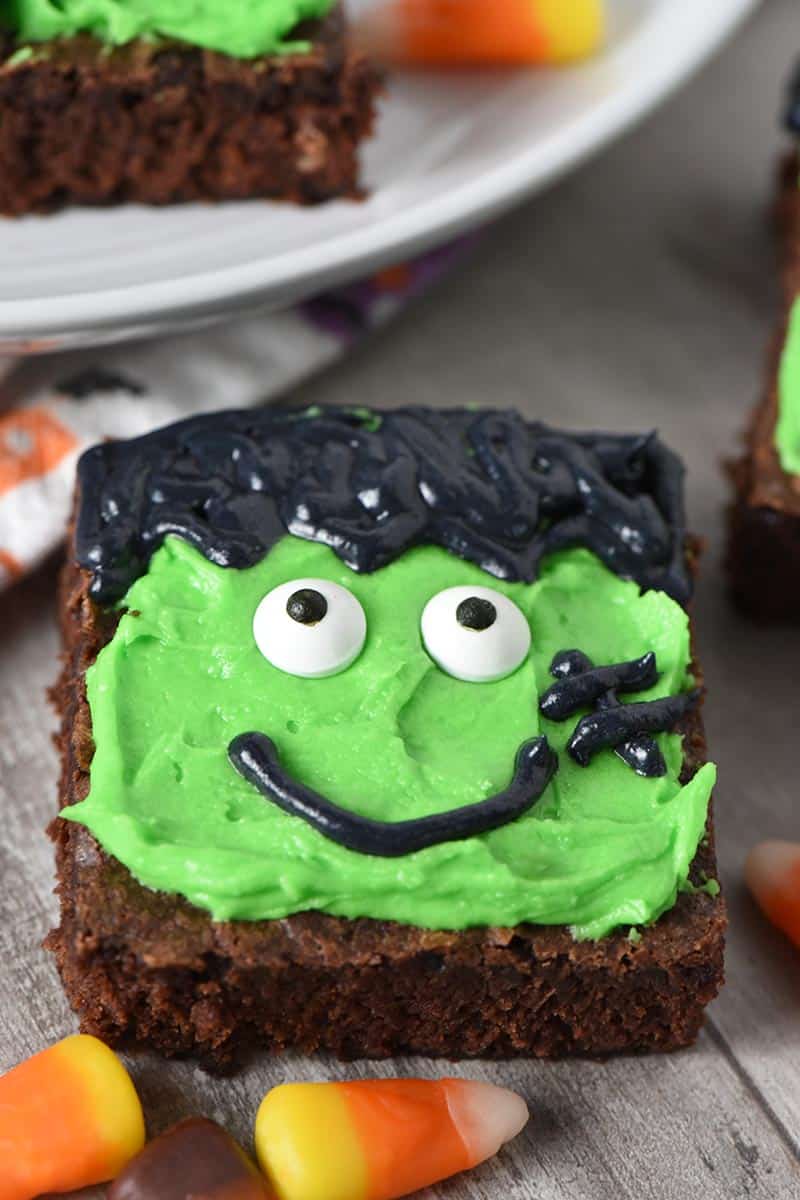 Frankenstein Halloween brownies on wood countertop with candy corn