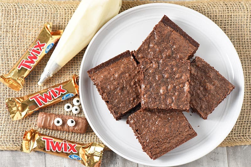 ingredients to make cute Halloween treats, Twix bar mummy Halloween brownies