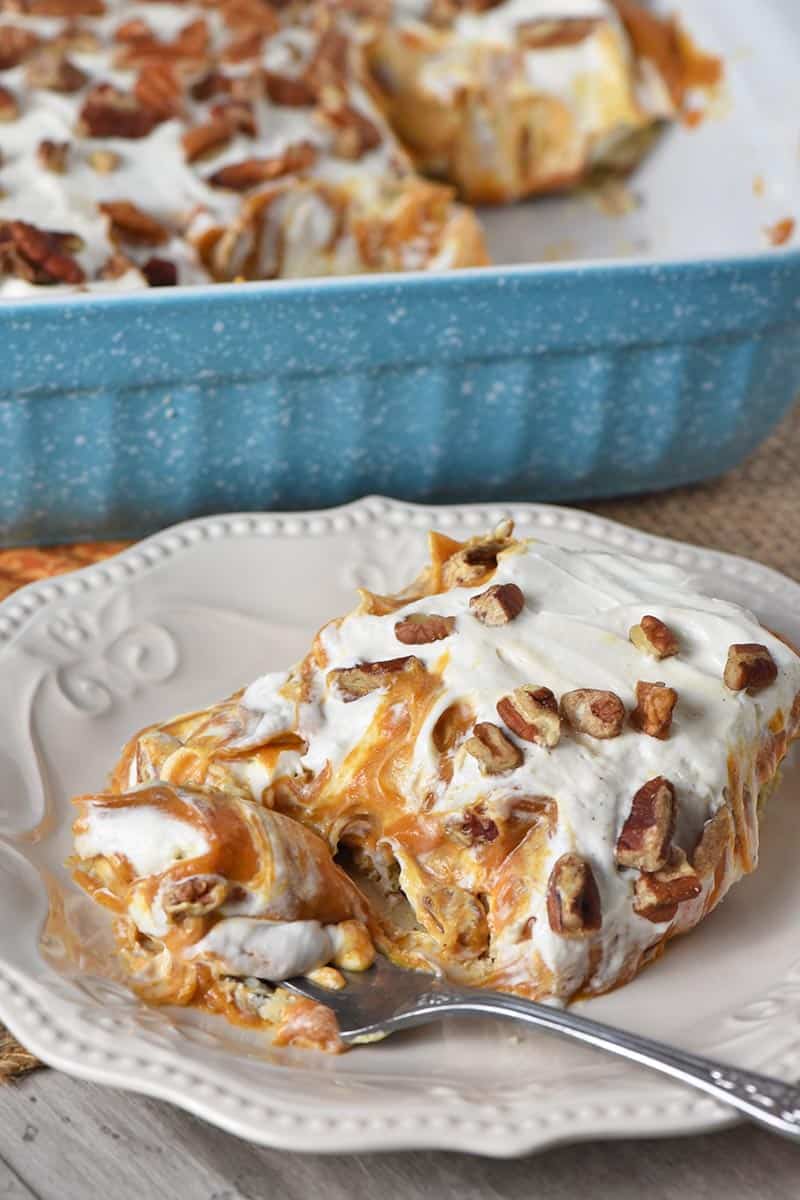 slice of no bake pumpkin dessert, no bake pumpkin pie with cream cheese on white plate