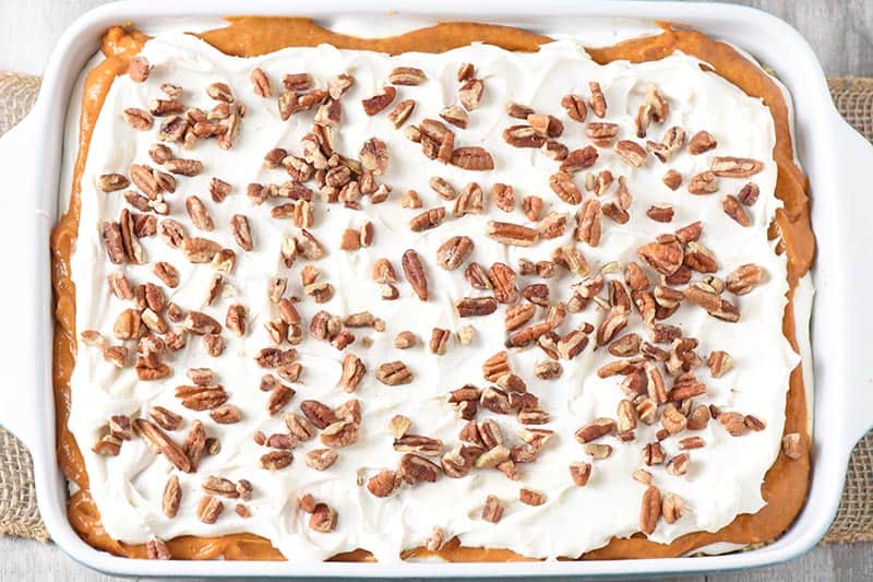 no bake pumpkin dessert with chopped pecans on top