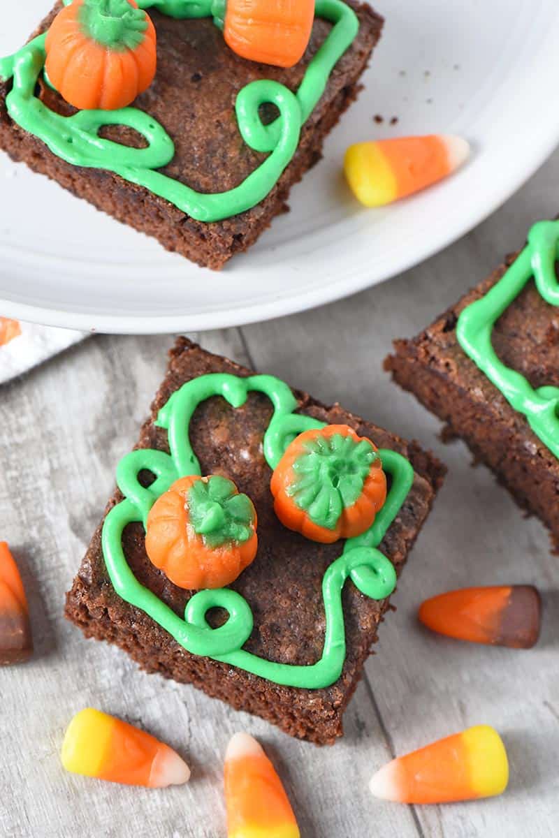 pumpkin patch halloween brownies made with mellowcreme pumpkins and green icing