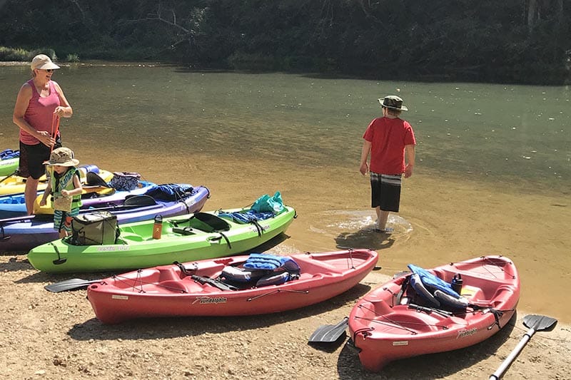 launching kayaks on the banks of the Current River at Akers Ferry