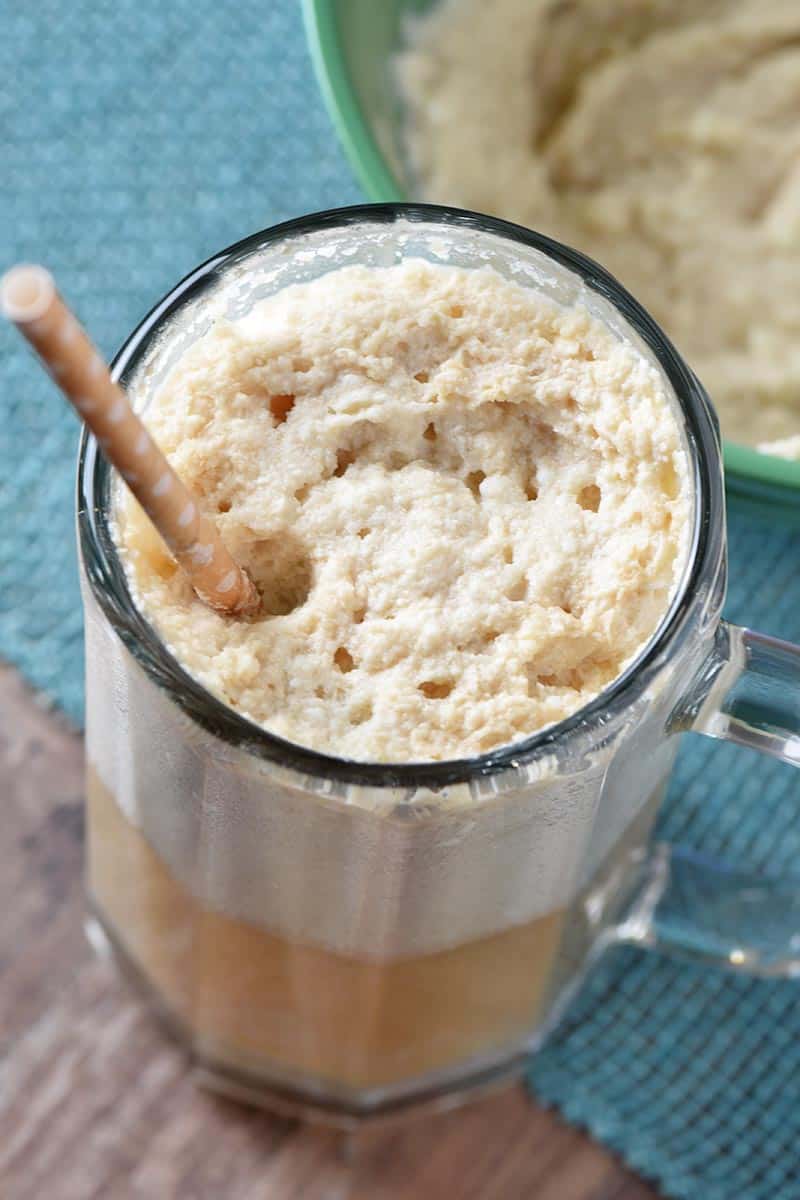 quick and easy butterbeer recipe in large glass mug with paper straw