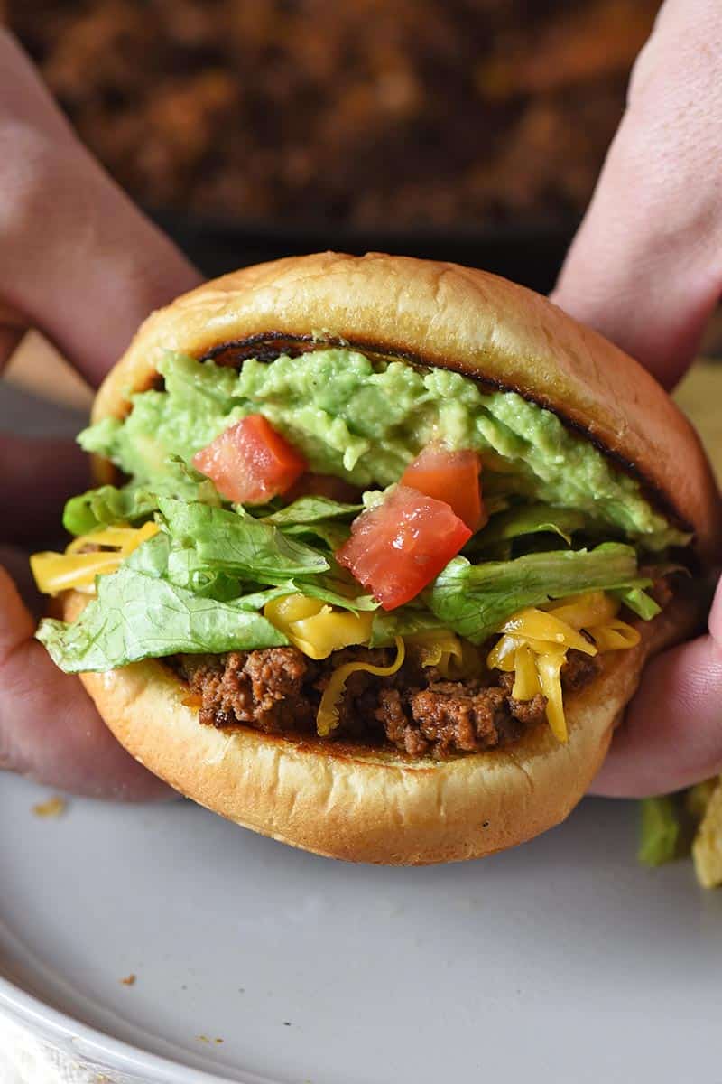 holding taco sloppy joe in hands
