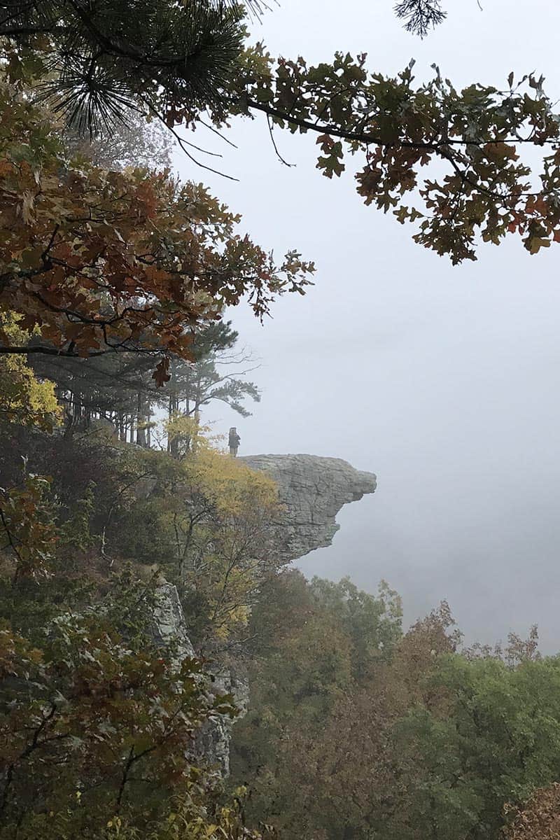 man on Hawksbill Crag from afar, Whitaker Point Trail in Arkansas
