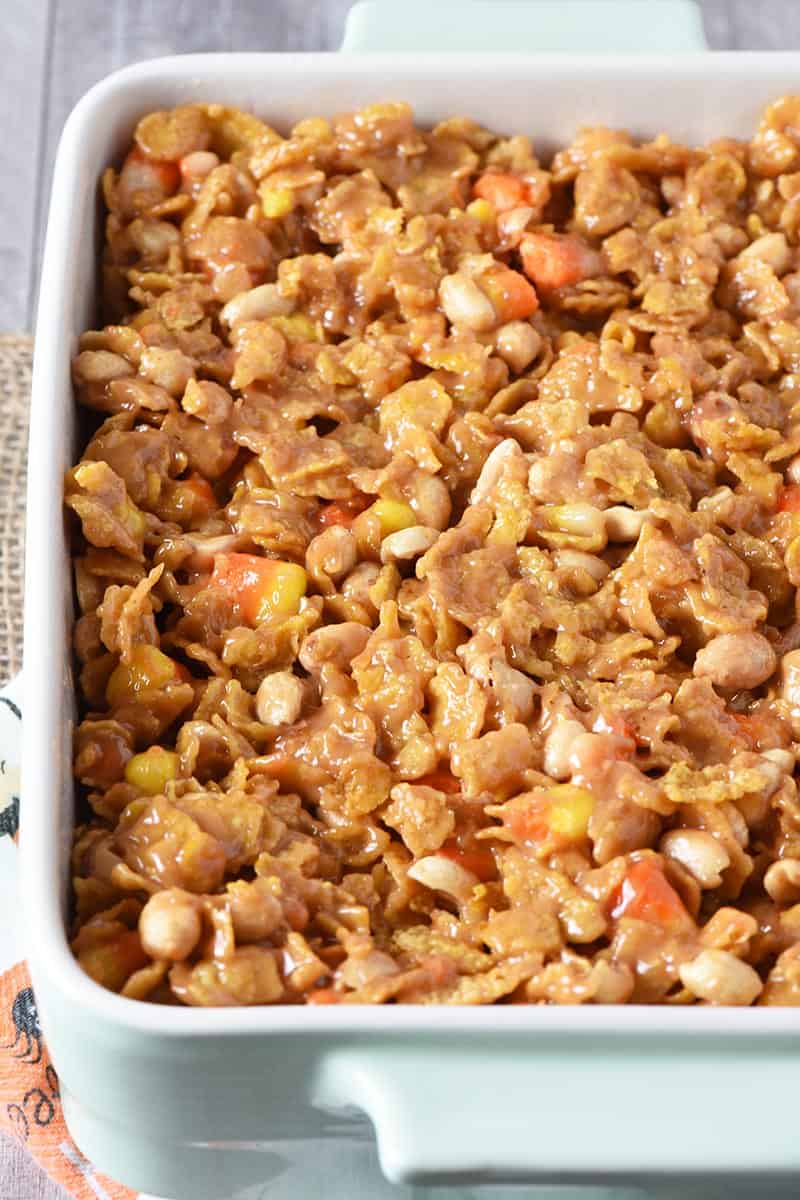peanut butter cereal bars in mint green baking dish