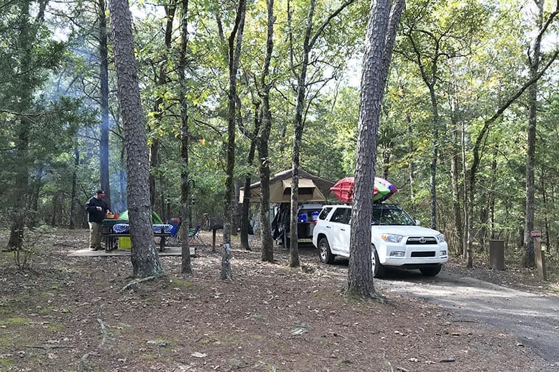 campsite with rooftop tent at Petit Jean State Park, one of our favorite Arkansas state parks