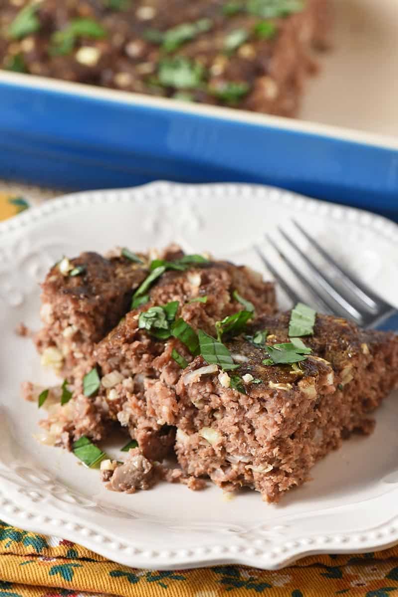 slice of low carb meatloaf on white plate with fork