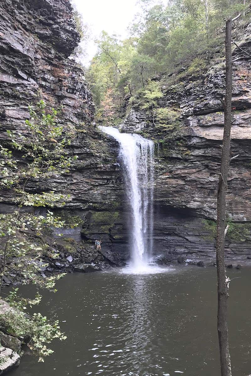 people standing beside Cedar Falls in Petit Jean State Park in Arkansas