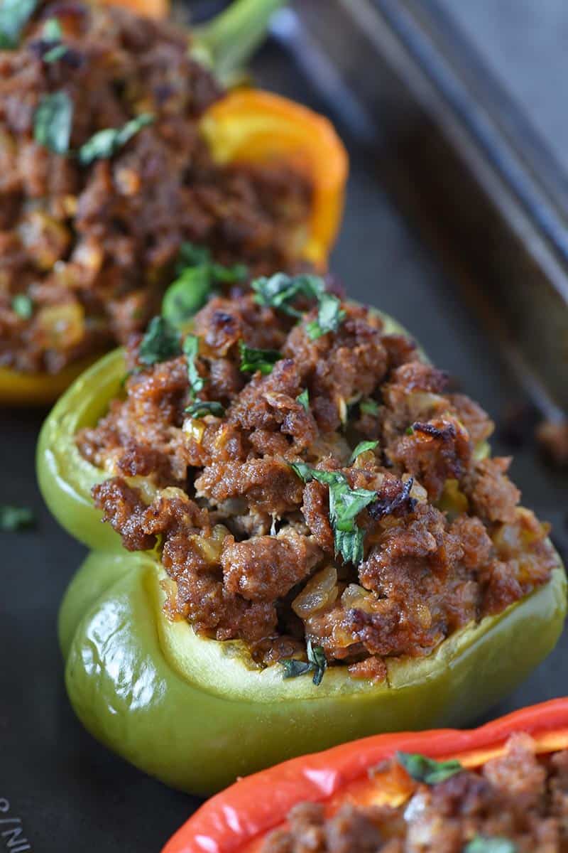 sloppy joe stuffed green peppers on baking sheet