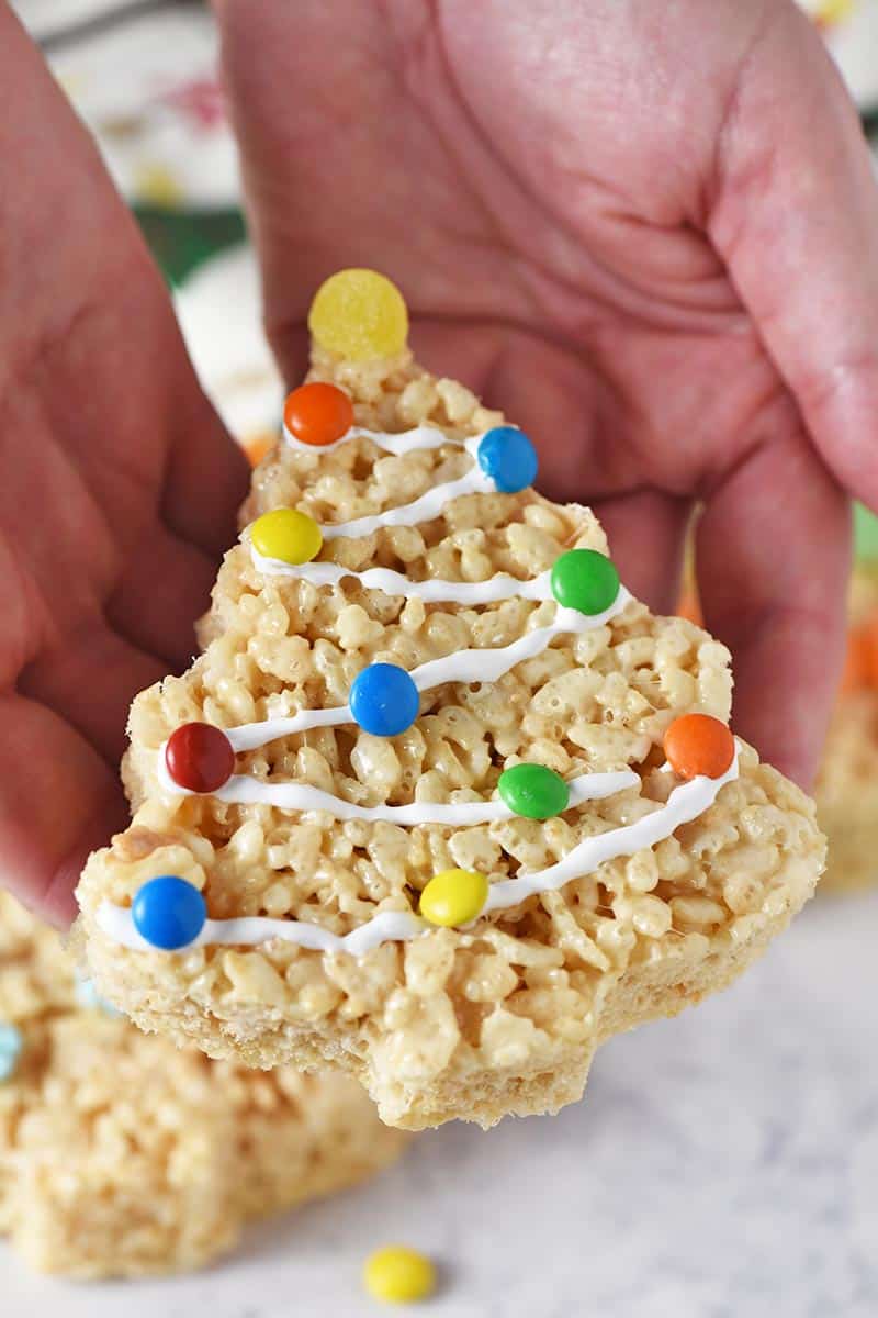 holding decorated Christmas tree Rice Krispie treats