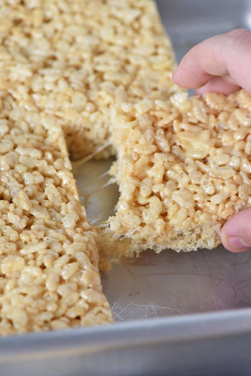 pulling Rice Krispie treats out of the pan