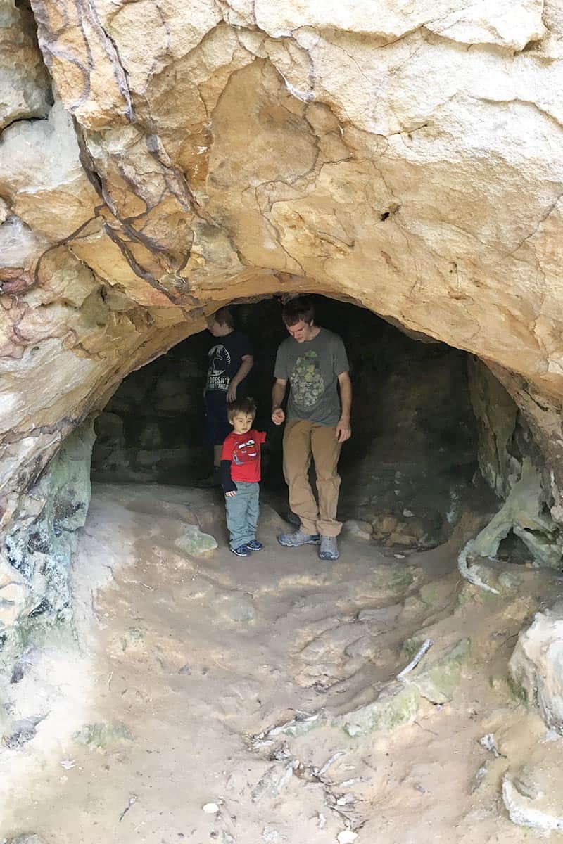 boys inside Bear Cave in Petit Jean