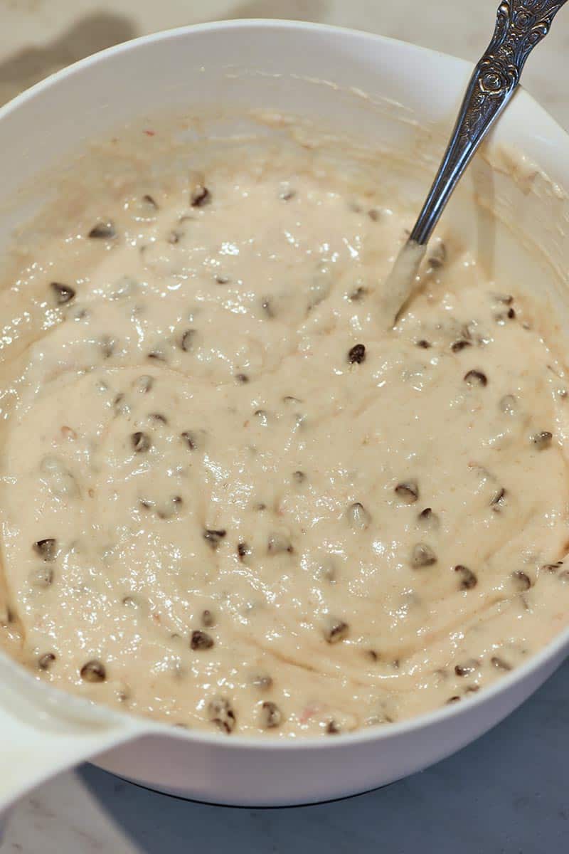 mixing batter for heart shaped pancakes recipe, folding chocolate chips into chocolate chip pancake batter