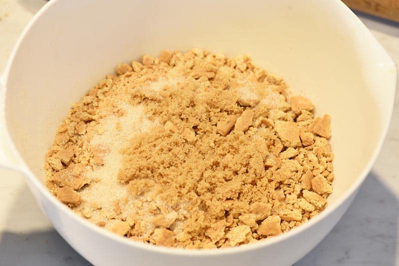 mixing ingredients for an easy graham cracker crust recipe
