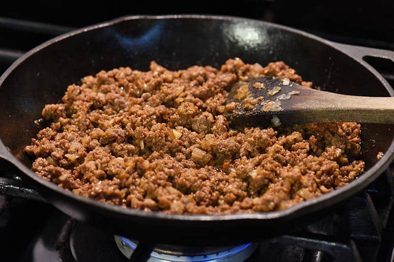 sloppy joe meat mixture in cast iron skillet on stovetop
