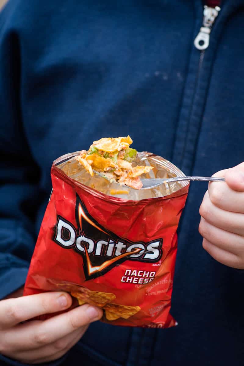eating taco in a bag with a fork