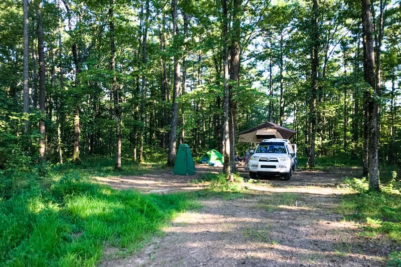 Ozark National Forest camping with rooftop tent and white Toyota 4Runner at free campsite