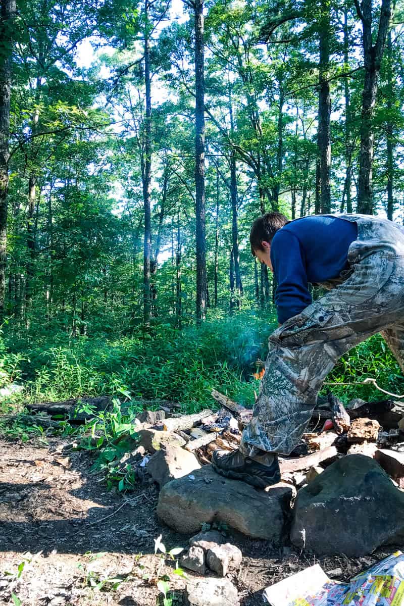 starting a campfire while camping in the Ozark National Forest in Arkansas