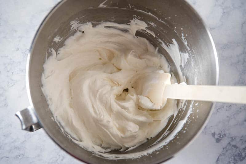 Dream Whip whipped topping in metal mixing bowl with white spatula