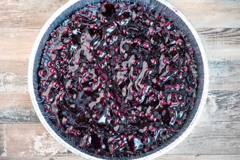 blueberry pie filling in round foil pan