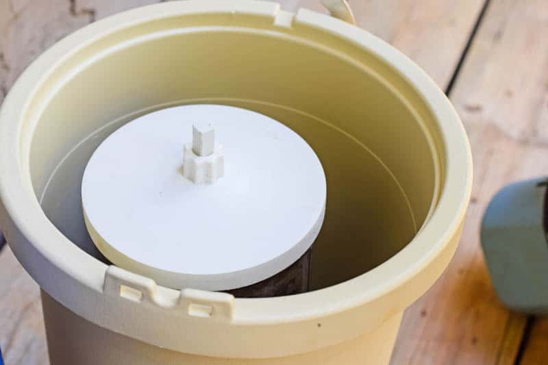 canister with white lid in plastic ice cream maker