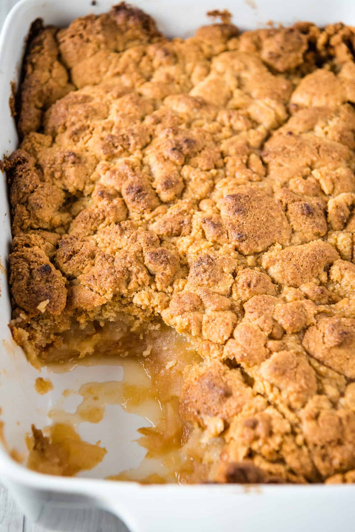 easy apple crumble baked in white baking dish and scooped
