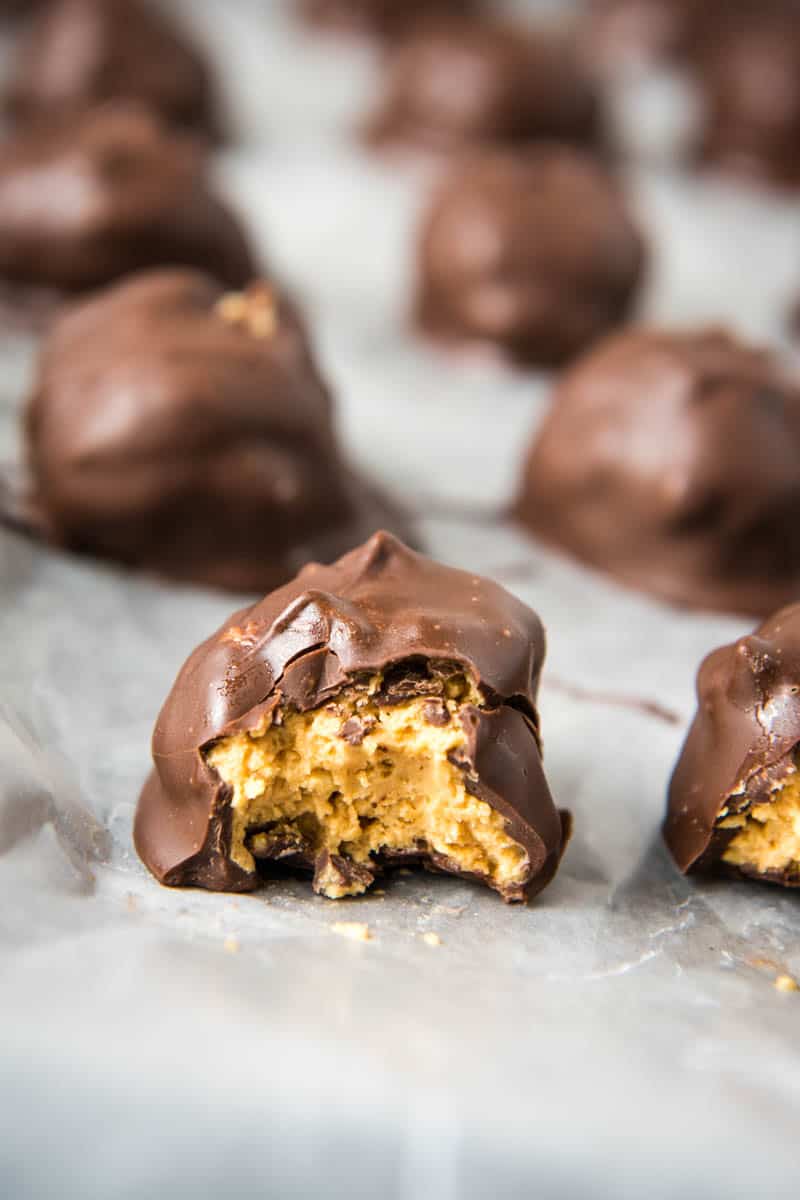 bite out of chocolate crispy balls on wax paper