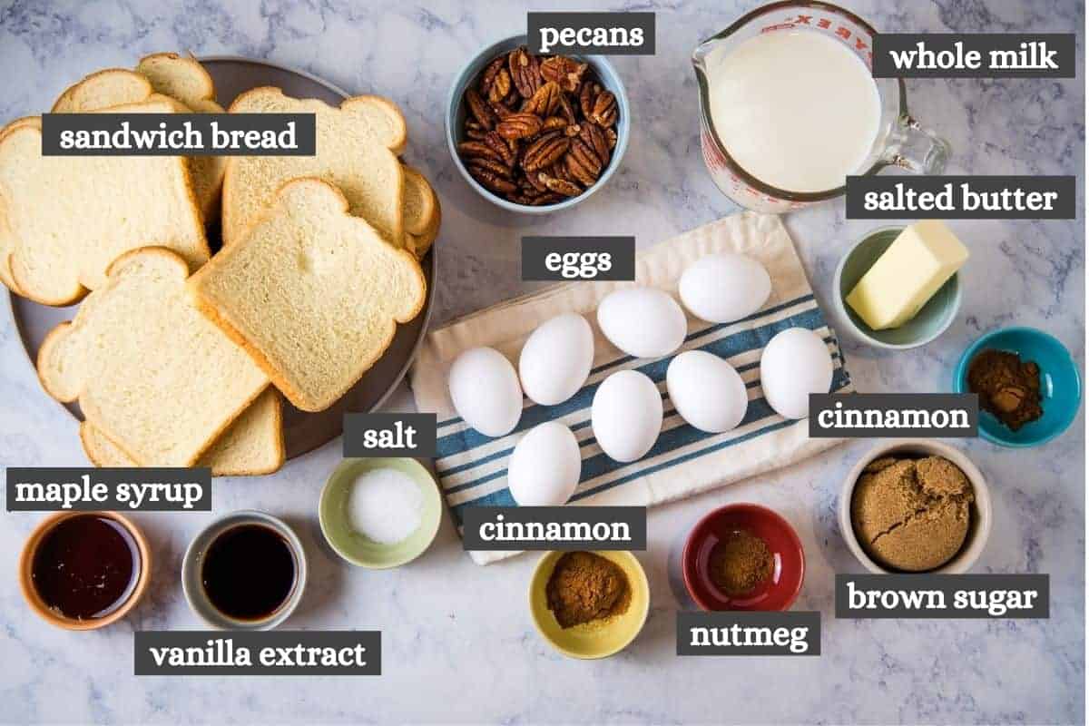 easy French toast casserole ingredients on white marble countertop