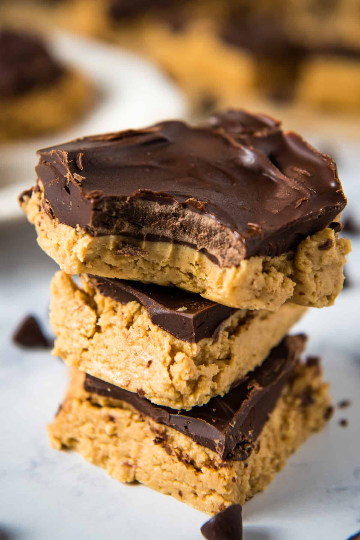 stack of peanut butter chocolate bars on white marble countertop