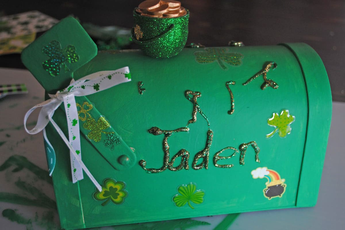child's name added to leprechaun box with green and gold glitter glue