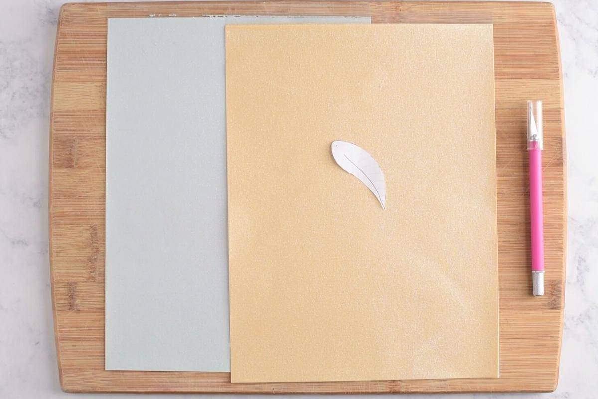 cut Golden Snitch wings out of sugar paper