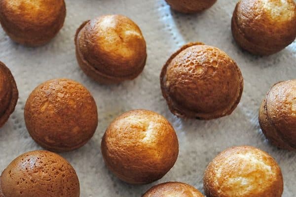 baked cherry chip cake balls cooling on paper towel