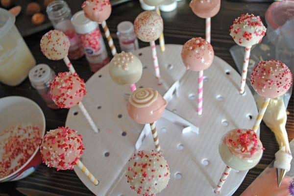 decorated Valentine's Day cake pops in Wilton cake pop holder