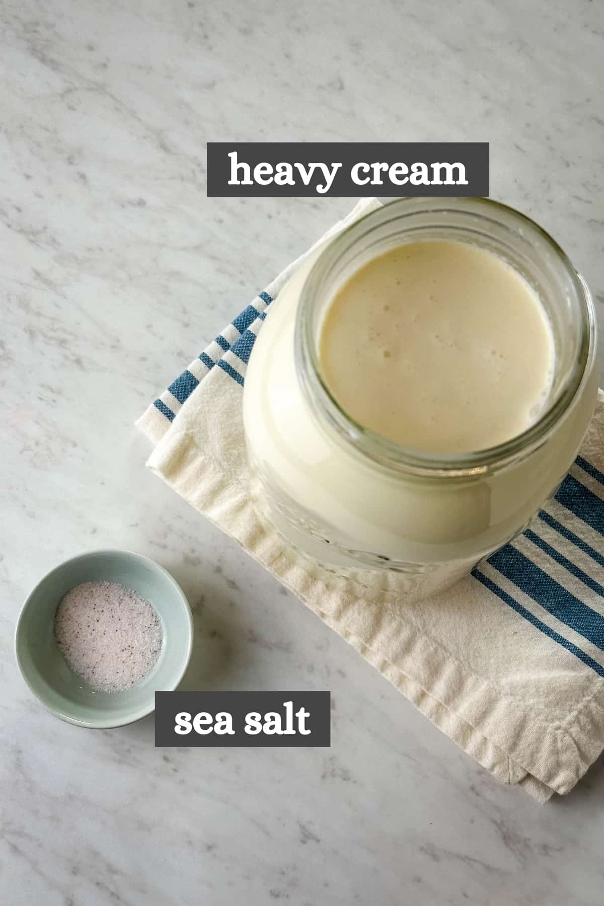 half gallon of raw milk cream and small bowl of sea salt, ingredients for homemade salted butter