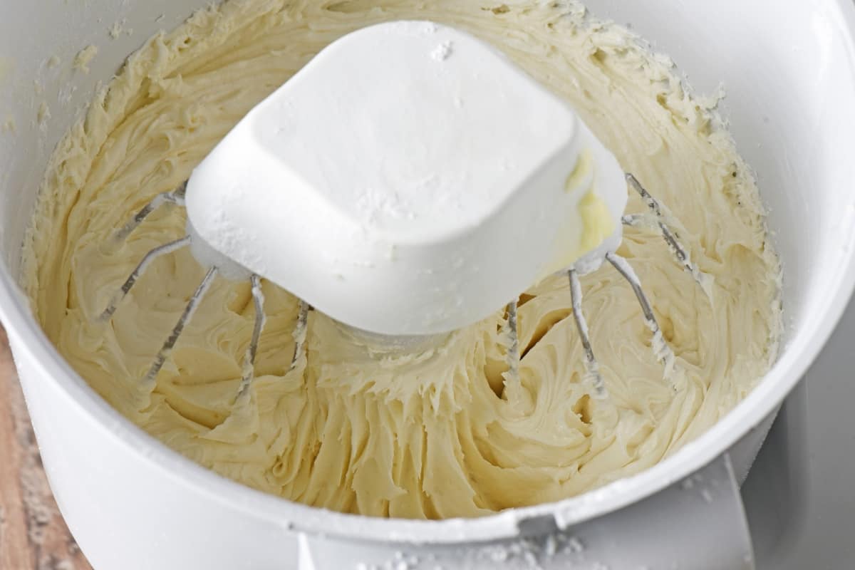 mixer bowl with buttercream frosting for Fourth of July cupcakes