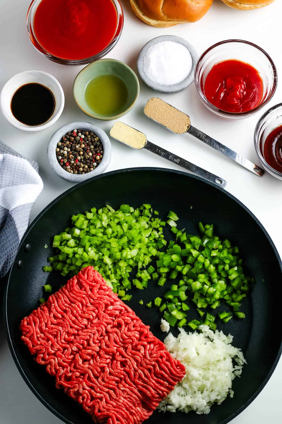 crock pot sloppy joes ingredients lined out on a white countertop