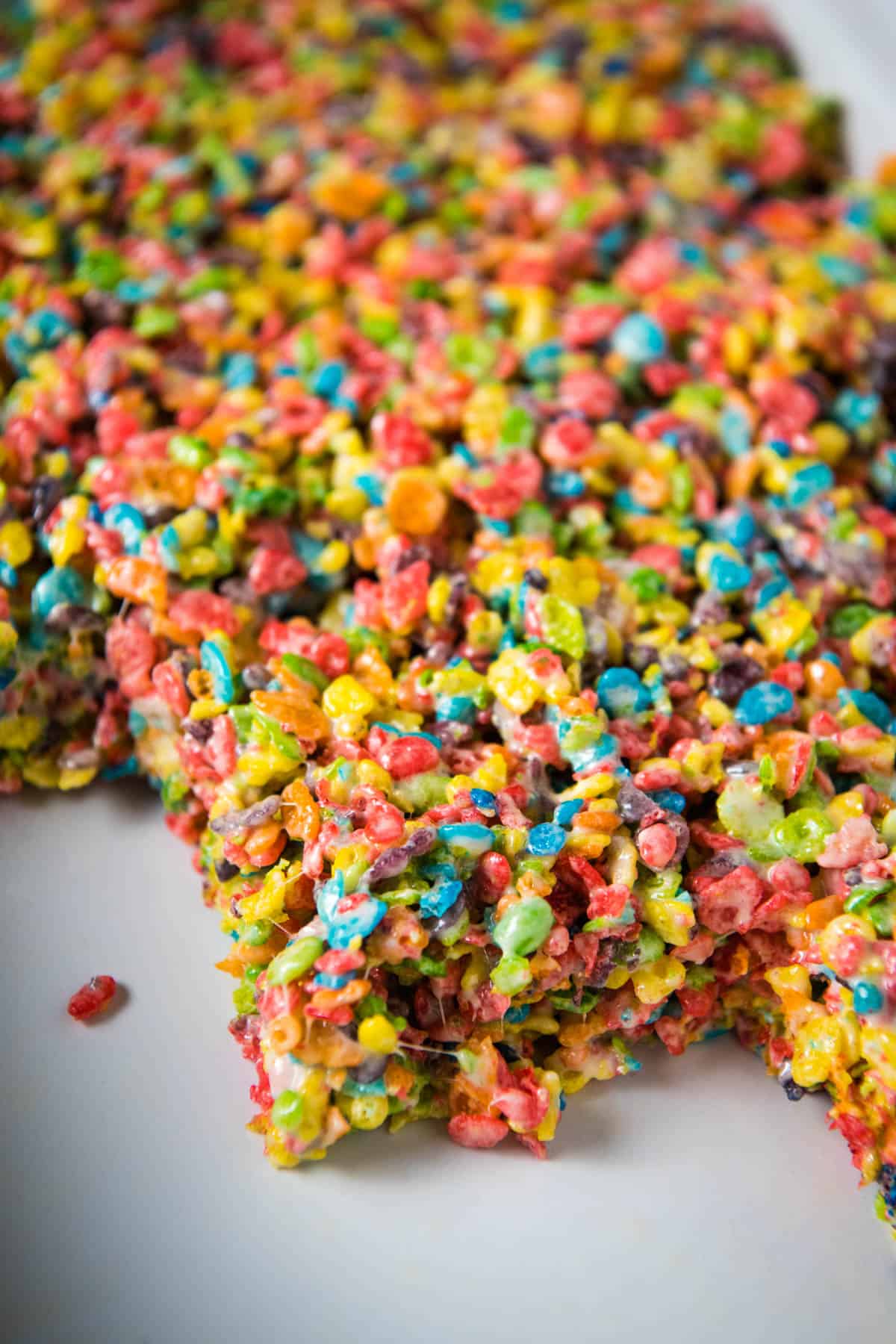 fruity pebbles treats in a large white baking pan