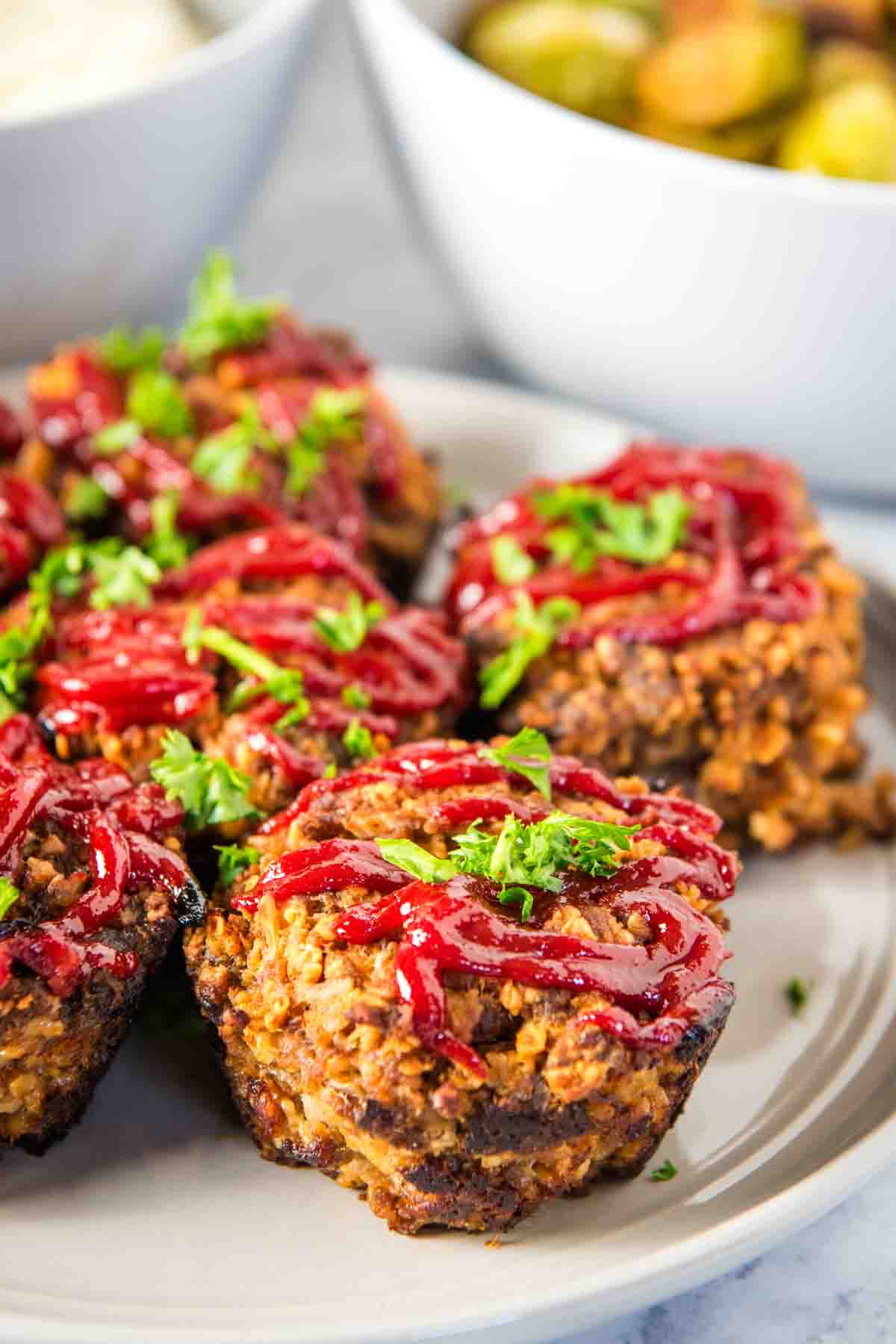 meat loaf muffins ready to eat on a small white decorative saucer