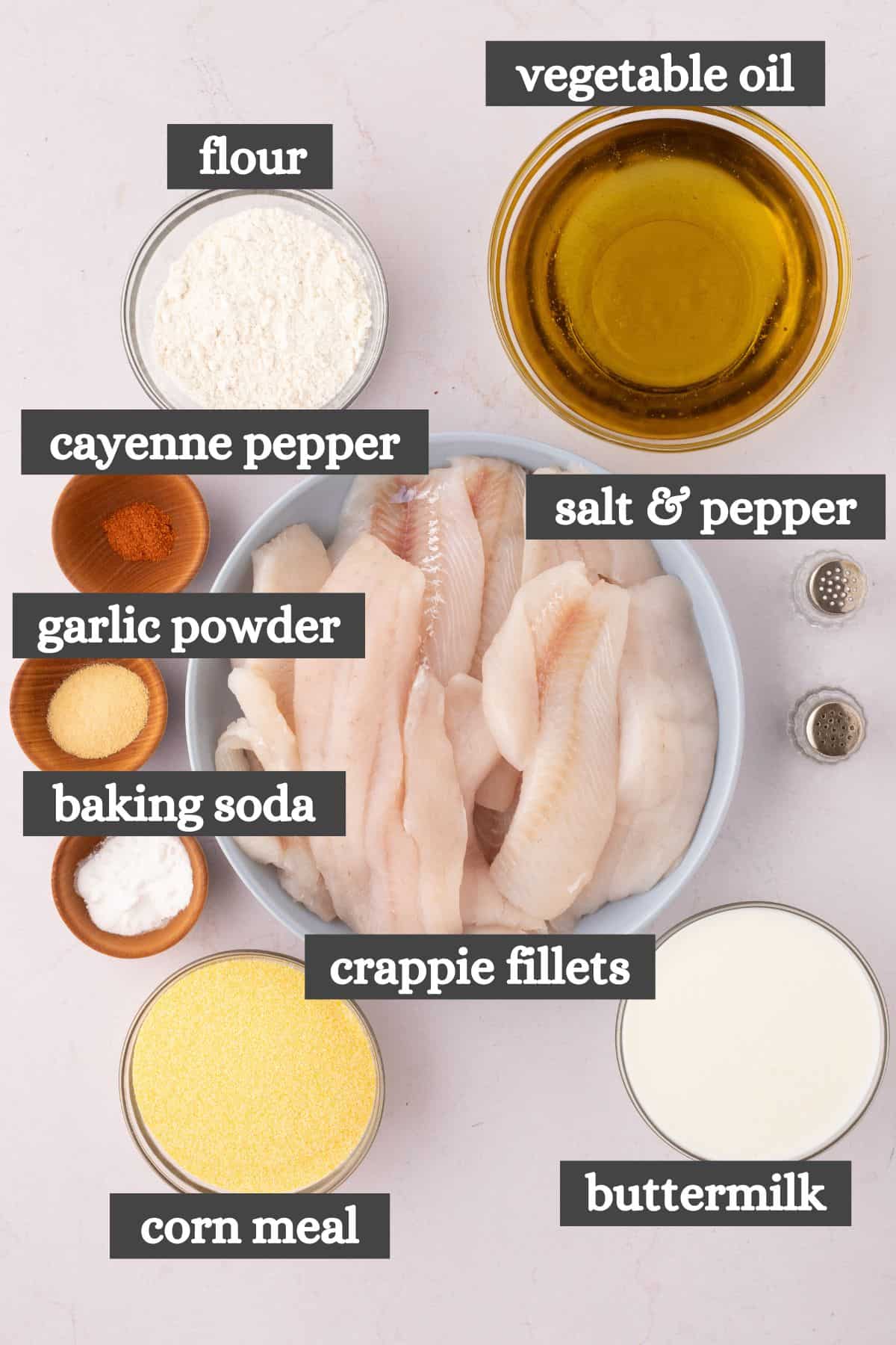 fried crappie ingredients lined out on a white marbled countertop