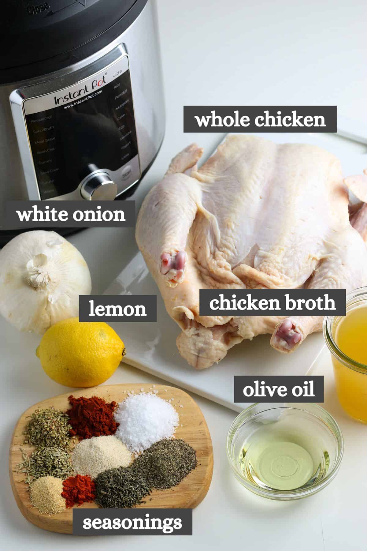 whole chicken Instant Pot ingredients lined out on a large wooden cutting board
